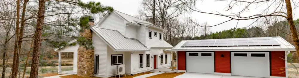 CEO achieves net-zero energy home house home family architecture window roof luxury exterior garage residential door wood property real building estate suburb bungalow facade