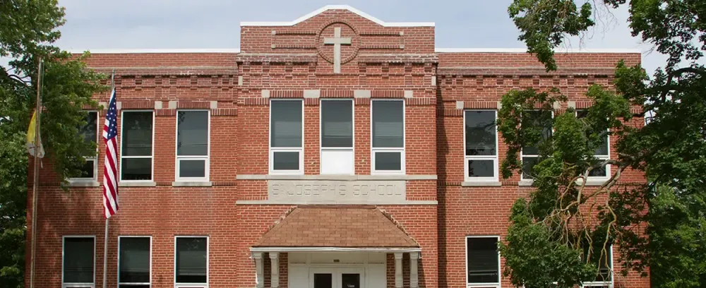 St. Joseph School architecture brick family home house building window facade construction urban outdoors real apartment exterior estate roof old front expression