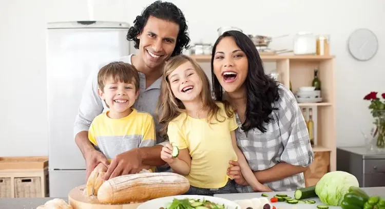 Total Home Comfort: the Little Luxury You'Ll Notice Every Day family togetherness cooking child fun indoors woman knife laughing lifestyle cute enjoyment salad love lunch casual preparation man happiness meal