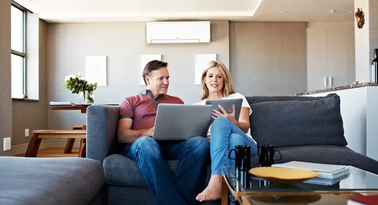 when Hiring An HVAC Contractor, Asking The Right Questions Matters sofa room seat indoors sit family computer man internet woman adult togetherness laptop house technology wireless relaxation leisure lifestyle
