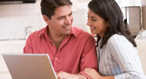 Big Home, Small Bills. Here'S How woman indoors internet man computer togetherness connection technology two sit laptop facial expression sitting wireless adult looking leisure room family