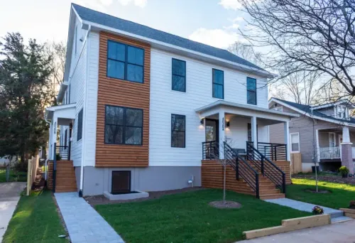 New Builds without Compromises: Symbi Homes Seeks to Develop Affordable, High-Performance Homeshome house yard family suburban architecture suburb residential real mortgage building property driveway lawn porch estate realty garage entrance window